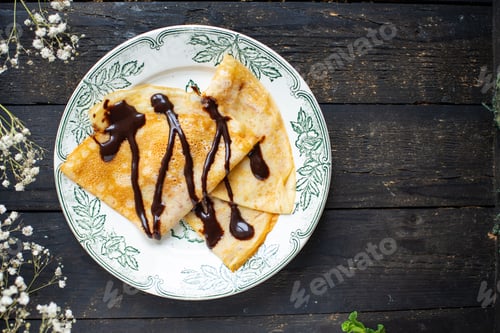 Preview: Thin Pancakes Pour Chocolate Crepes Syrup White Plate Flat Cake Snack Meal Top View Copy Space