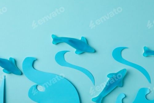 Preview: Gummy candies in the form of whale and decorative waves on blue background
