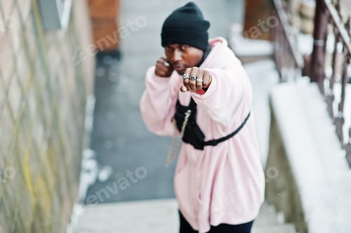 Preview: Stylish urban style african american man in pink hoodie