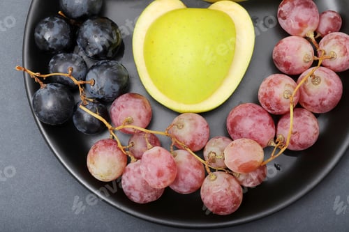 Preview: fresh fruits grapes, apples, on the plate