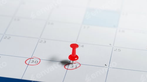 Preview: Red tack on circled date on monthly planner, representing schedule planning, or business appointment