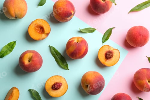 Preview: Fresh ripe peaches and green leaves on color background, flat lay