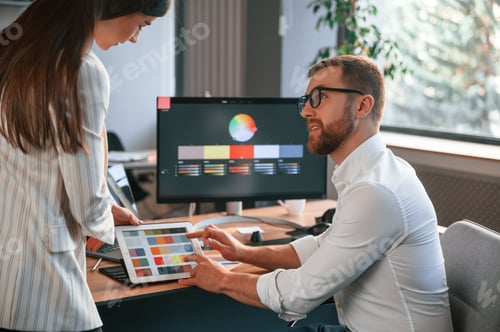 Preview: Creative job. Two designers are working together in the modern office