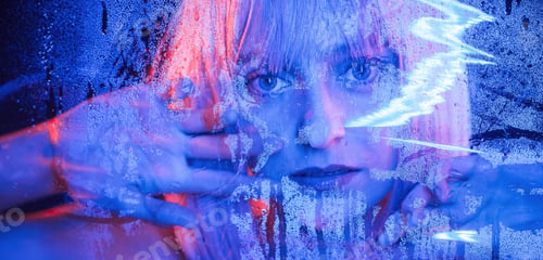 Preview: Looking at camera. Stylish woman with white hair is behind wet transparent plastic sheet