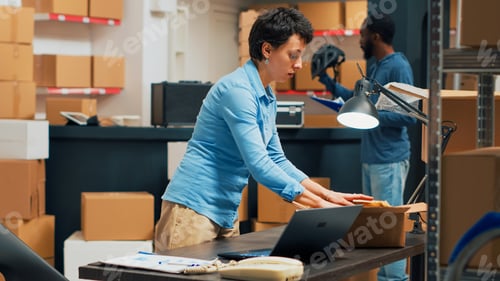 Preview: Small business owner putting supplies in cardboard boxes