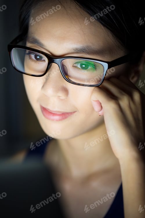 Preview: Woman look at computer at night