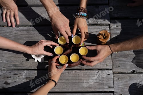Preview: Top view tea set a wooden table for tea ceremony background. Woman and man holding a cup of tea