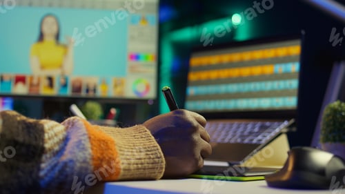 Preview: Professional man in creative setup at home uses digital tools for graphic design