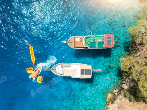 Preview: Aerial view of yachts and boats on the sea at sunset in summer
