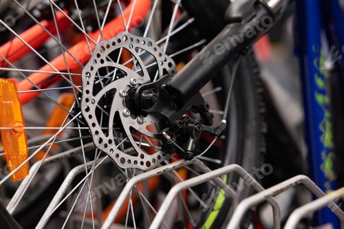 Preview: Part of road Bike brake disc in close up. Bicycle shop maintenance technical expertise. details