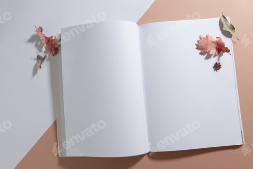 Preview: Composition of opened book with blank pages decorated with dry leaves on white and beige
