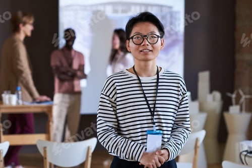 Preview: Smiling Individual at a Meeting with Coworkers