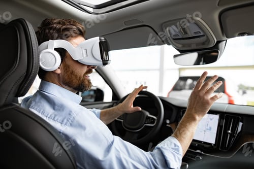 Preview: Man using virtual reality headset inside modern car
