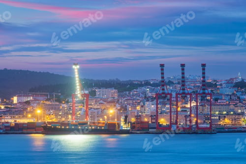 Preview: View of Lisbon port with ship and port cranes in the evening