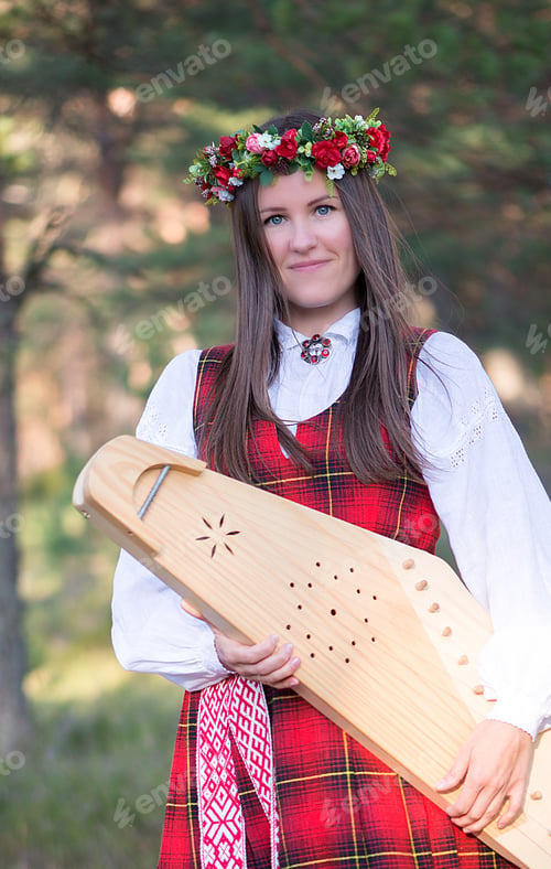 Preview: Portrait of beautiful young woman with harp in woodland,fantastic evening sunlight,harpist