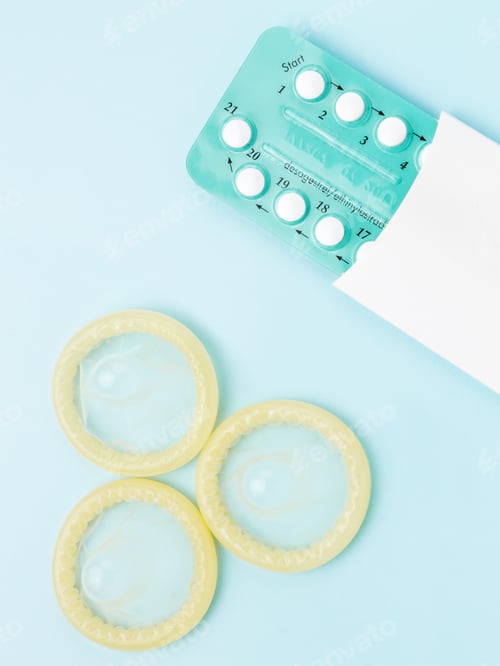 Preview: Contraceptive pills and condoms on blue background. Concept of birth control