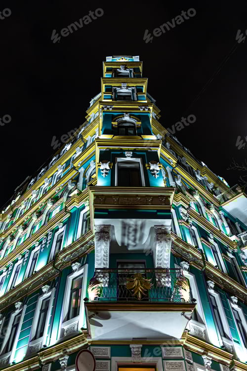 Preview: Beautiful architectural building at night with illumination.