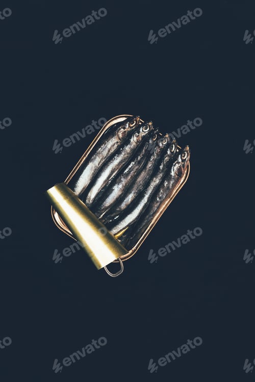 Preview: Top view of pile of fish in can isolated on black