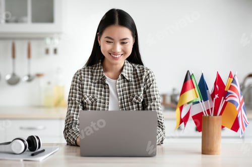 Preview: Cheerful asian woman student looking for online course