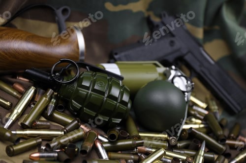 Preview: Different types of ammunition on a camouflage background. Preparing for war
