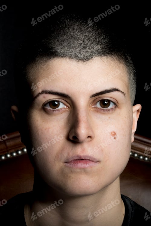 Preview: Tattooed woman indoors, Milano, Italy.