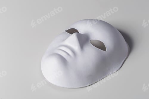 Preview: Plain white mask resting on a smooth surface ready for decoration or performance