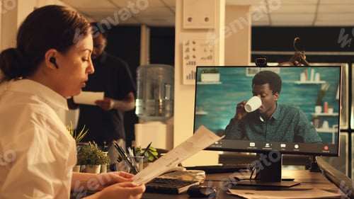 Preview: Manager chatting with employee on online videocall conference