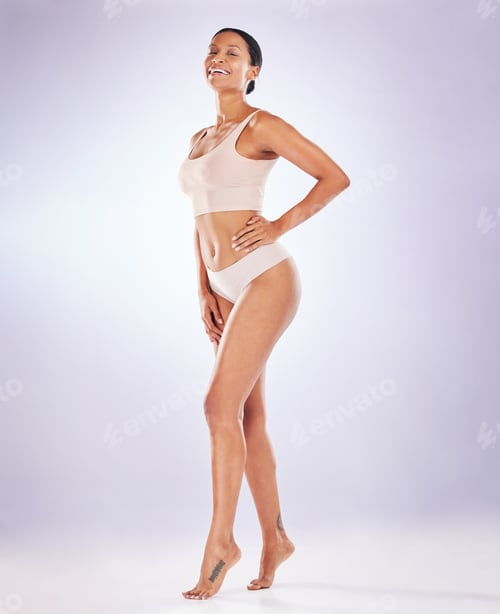 Preview: Portrait, proud and underwear with a model woman in studio on a gray background to promote skincare