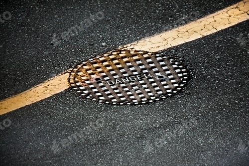 Preview: Manhole cover on asphalt