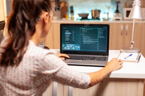 Preview: Female hacker sitting in front of computer