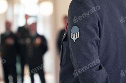 Preview: Willing and able to defend. Shot of a military badge on a high ranking officers jacket.