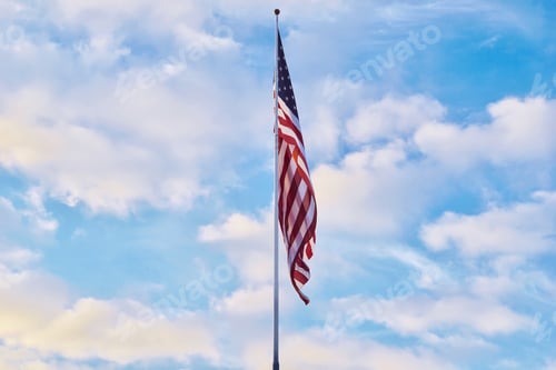 Preview: Gigantic American Flag blowing in the wind in the Summer sky