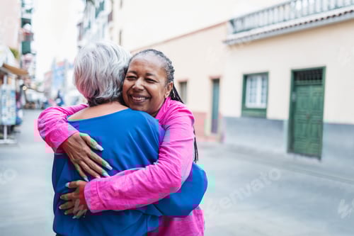 Preview: Two Women Embracing Affectionately in a Neighborhood Setting