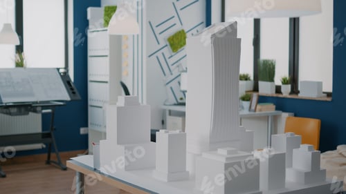Preview: Table with building model and maquette presentation in empty architectural space