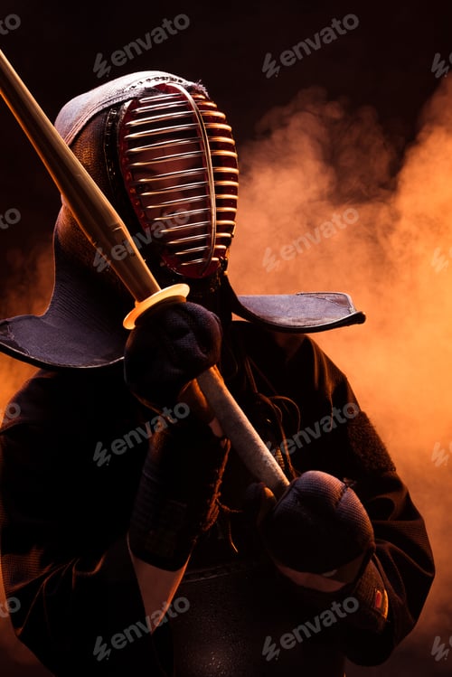 Preview: Kendo fighter in armor holding bamboo sword in smoke