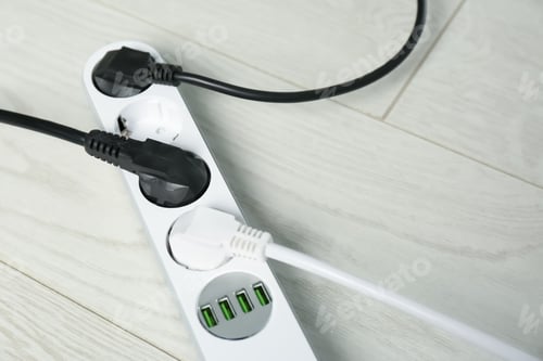 Preview: Extension cord on floor, space for text. Electrician's professional equipment