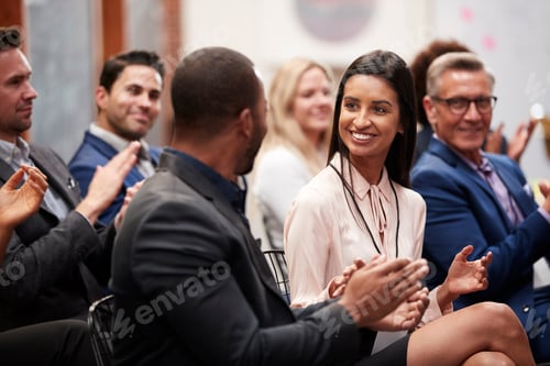 Preview: Group Of Businessmen And Businesswomen Applauding Presentation At Conference