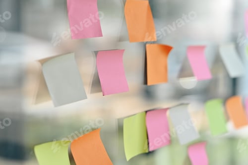 Preview: Closeup of colorful blank sticky notes, reminder paper note on glass wall in modern office.