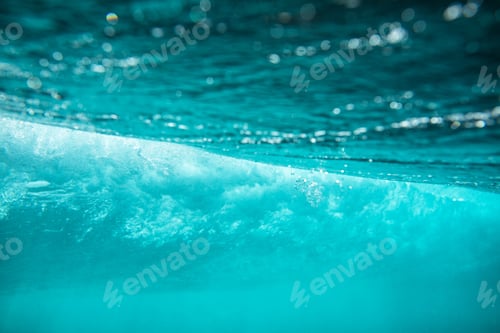 Preview: Closeup shot of a water surface with the reflection of beautiful sun rays