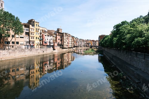 Preview: Cityscape along a river with ducks swimming