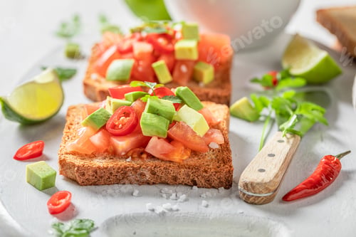 Preview: Crunchy and delicious toasts with avocado, tomatoes and coriander.