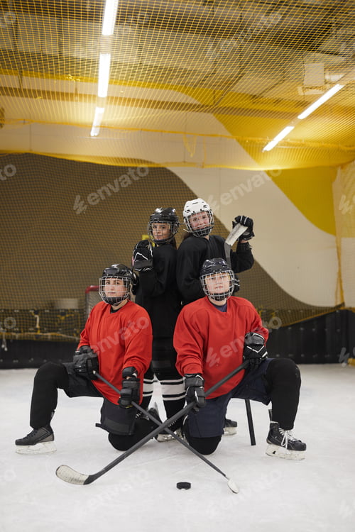Preview: Female Hockey Team Posing on Ice