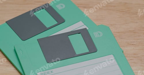 Preview: Two Green floppy disc on table