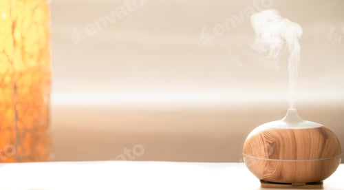Preview: Modern oil aroma diffuser in the living room on the table.