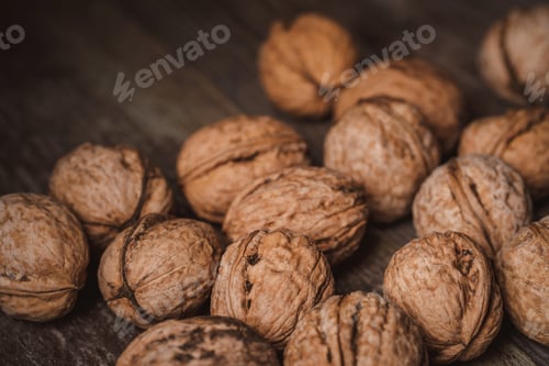 Preview: close up view of walnuts on wooden tabletop