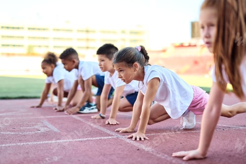 Preview: Children having sport exercise training class outdoors
