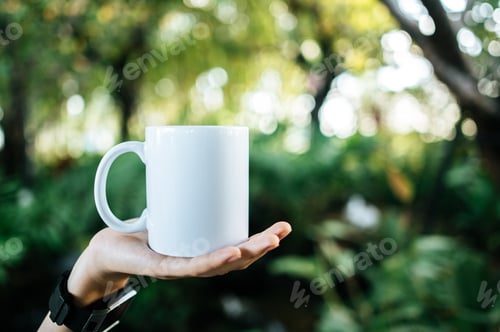 Preview: white cup on hand in relax time