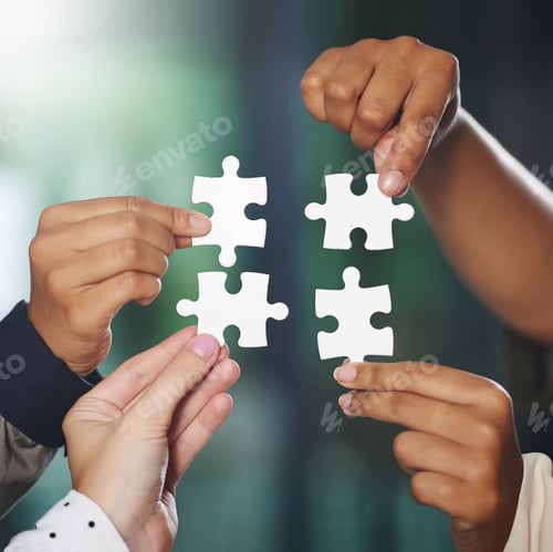 Preview: Cropped shot of a group of unrecognisable businesspeople putting puzzle pieces together
