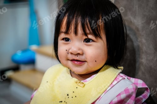 Preview: Happy funny girl having dragon fruit topping over her face.