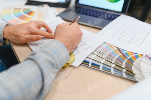 Preview: Interior designer hands drawing blueprint plan